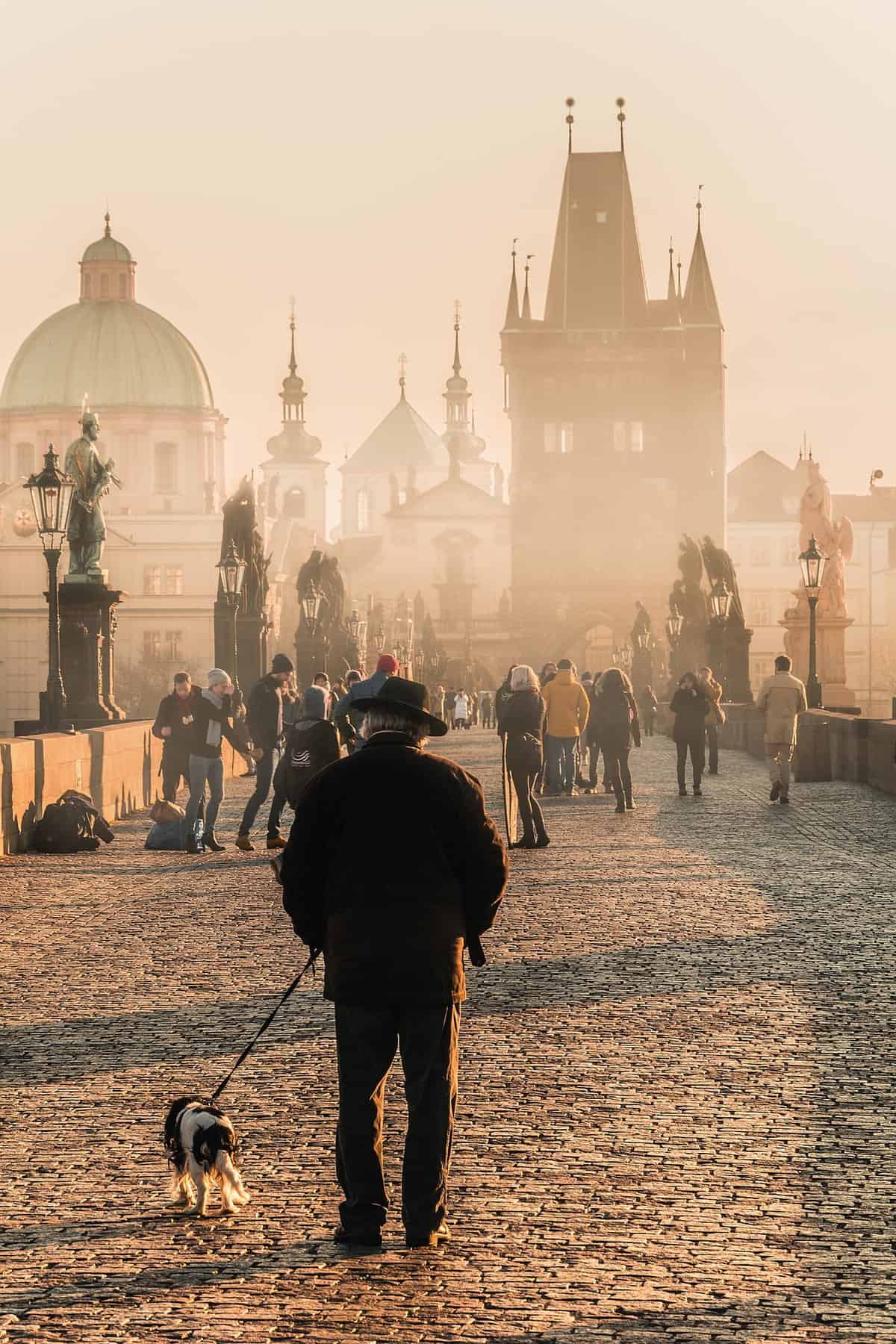 Man-walking-on-the-Charles-bridge