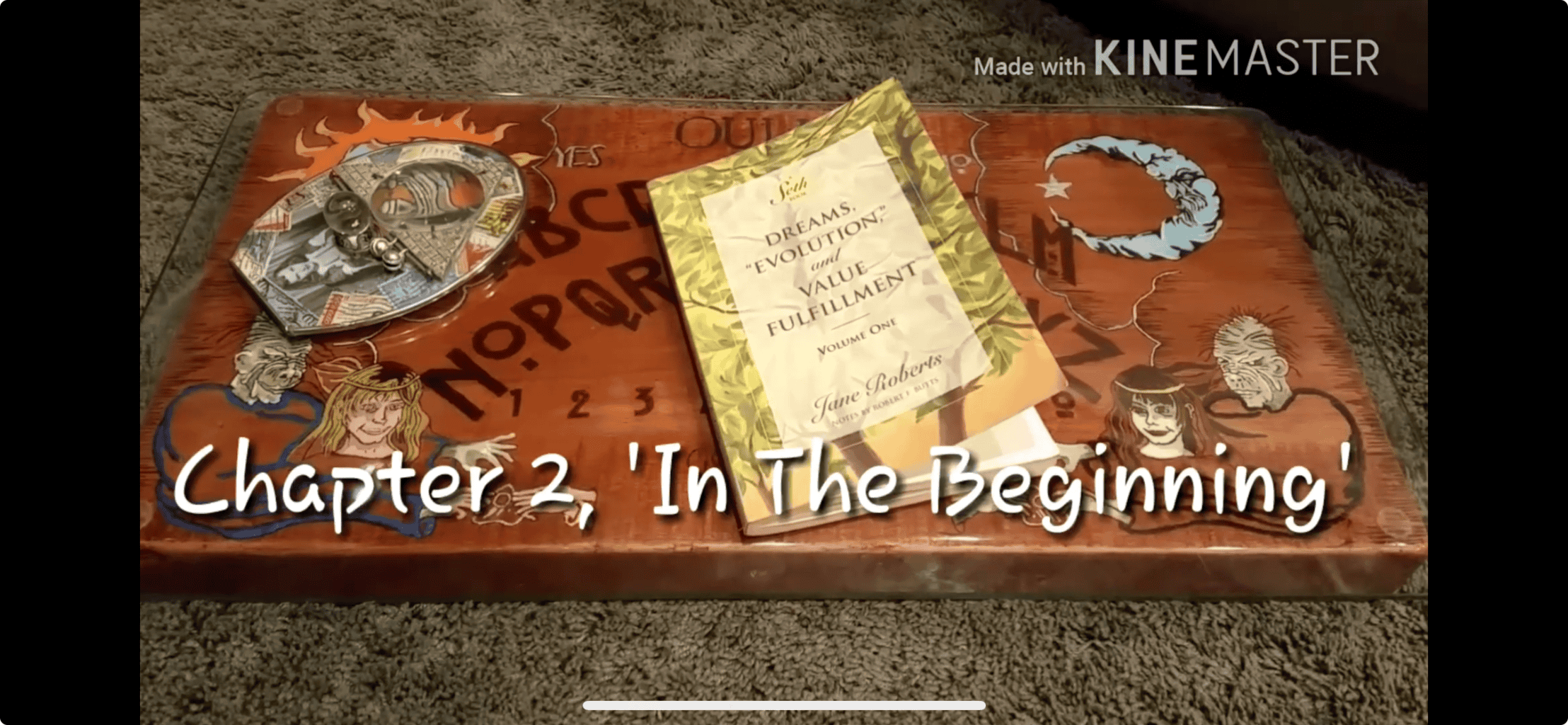 “in the beginning” Book, ouija-style board with 'Chapter 2, In The Beginning'.