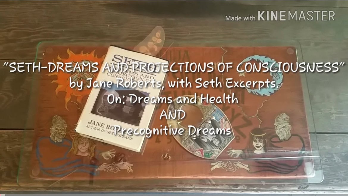 img 7406 Books on dreams and consciousness displayed on table.
